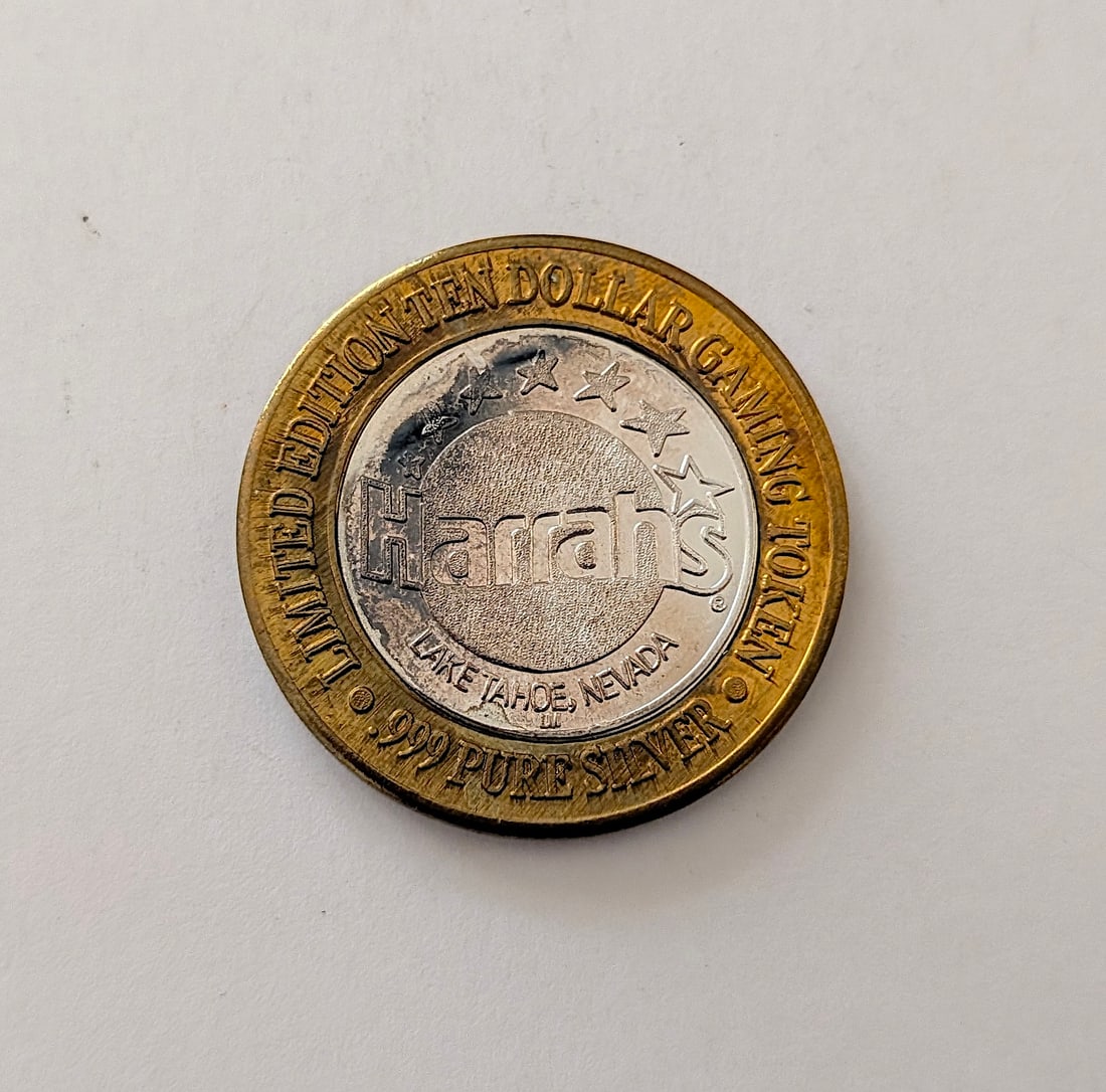 Harrah's Casino in Lake Tahoe Ltd. Ed. $10 Gaming Silver Token: It is a collectible "Silver Strike" token, which were popular in Las Vegas casinos. The center is made of .999 fine silver. It has approximately 0.6 troy oz .999 Silver and the vintage design can be r