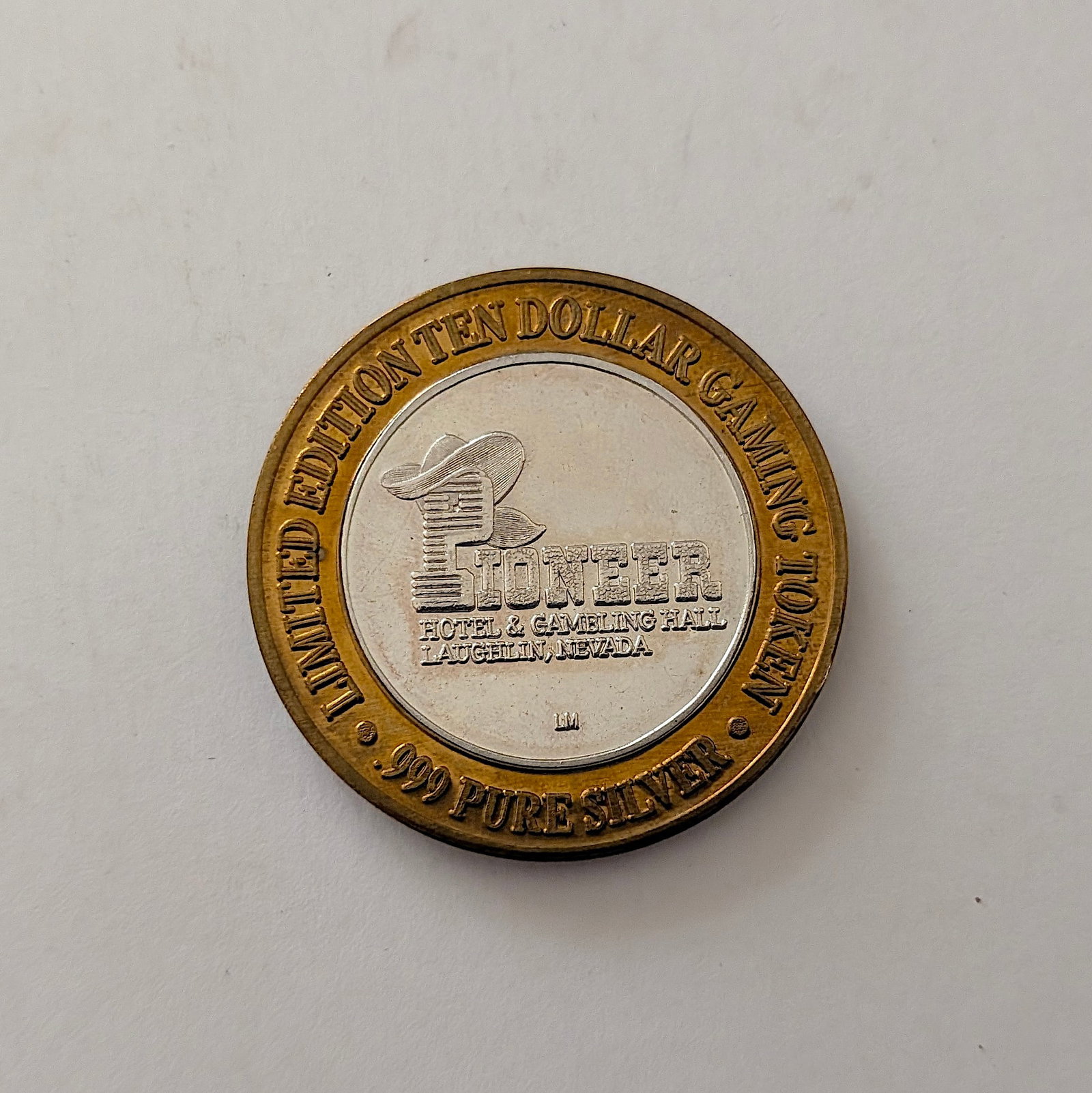 Pioneer Hotel & Gambling Hall Ltd. Ed. $10 Gaming Silver Token: It is a collectible "Silver Strike" token, which were popular in Las Vegas casinos. The center is made of .999 fine silver. It has approximately 0.6 troy oz .999 Silver and the vintage design can be r