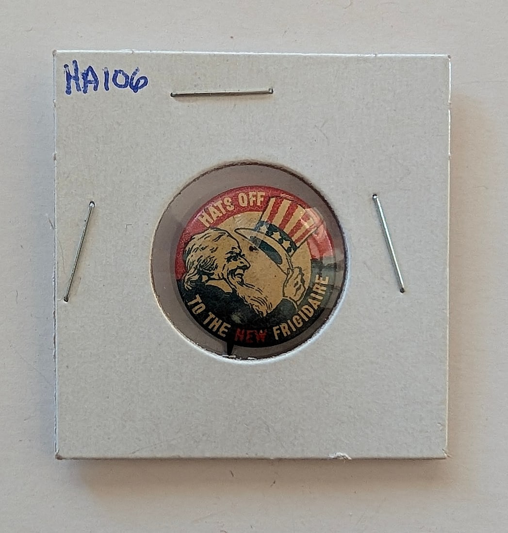 Vintage Frigidaire advertising pin featuring patriotic imagery of Uncle Sam (1 of 2)