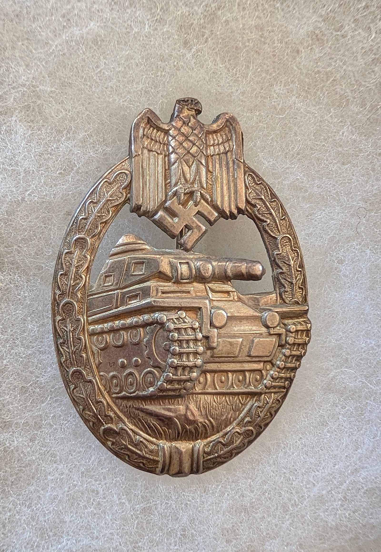 Panzer Assault Badge by GWL Hollow Version: An original Panzer assault badge bronze by GWL (Panzerkampf Abzeichen Bronze) die-struck in zinc with bronze wash. The reverse of the badge is an unmarked, hollow version attributed to Gebr?der Wegerh
