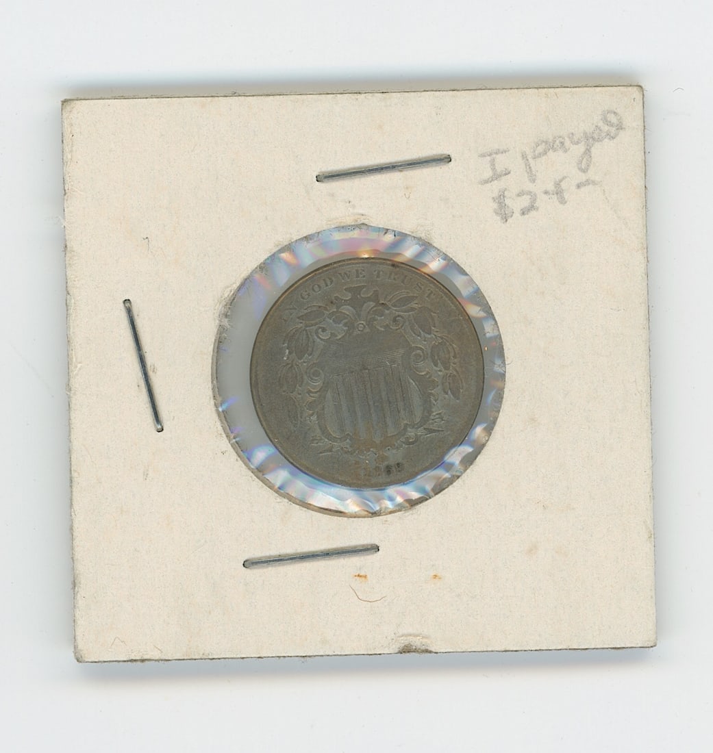 1869 Shield Nickel US five-cent coin minted in Philadelphia: The provenance of this item is from the inventories of Artelisted. We have included quality images to show it's actual condition. THIS IS A RESERVE AUCTION, and the final price will include a Buyer?s 