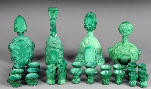 Assorted Faux Malachite Glass Table Articles: Comprising decanters and shot glasses. Various styles and sizes. Tallest decanter height 13 inches.