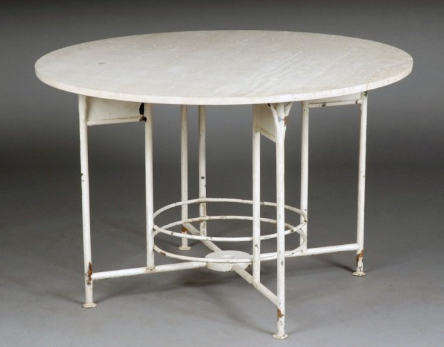 White Painted Metal Occasional Table: Circular travertine top, white painted metal base. Height 28 inches, diameter 43 inches.