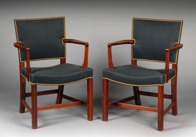 Set of Four Hepplewhite Style Mahogany Armchairs: Black fabric upholstered back and seat with nail head decoration, square legs joined by an H stretcher. Height 36 inches, width 23 inches, depth 19 inches.
