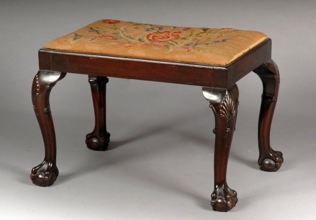 George II Style Mahogany Footstool: Rectangular needlepoint slip seat, cabriole legs ending in ball and claw feet. Height 18 inches, width 25 inches, depth 18 inches.
