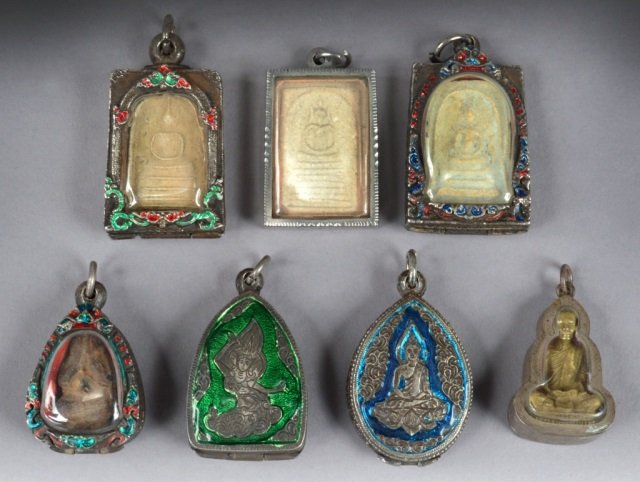 Set of Seven Tibetan Buddhist Amulets: Various sizes.