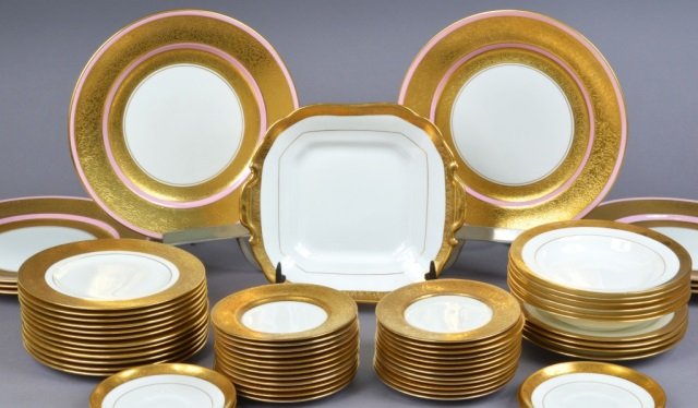 Group of Assorted English Dinner Service Dishes: Parcel gilt decorated. Approximately 55 pieces including dinner plates, soup bowls, bread plates, serving dish, etc. Dinner plate diameter 11 1/4 inches.
