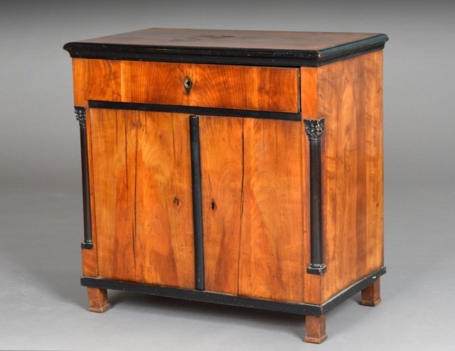 Biedermeier Walnut Veneered Cabinet: Mid 19th century, neoclassical style. Rectangular top over a single drawer and a two door cabinet with ebonized decoration, four square feet. Height 30 inches, width 30 inches, depth 17 1/4 inches.