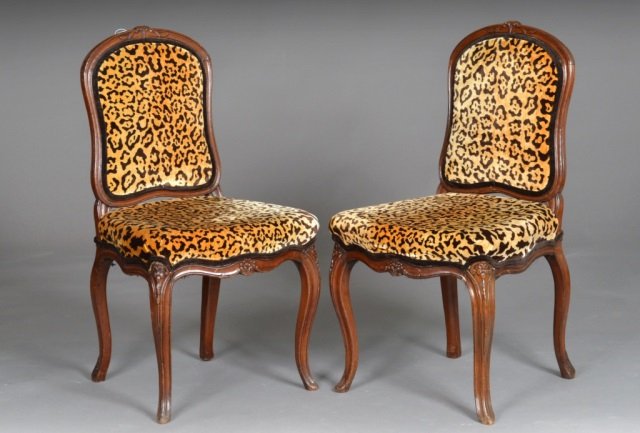 Pair of French Louis XV Style Walnut Chaise: Each, with leopard print upholstered back and seat, cabriole legs. Height 37 1/4 inches, width 20 inches, depth 21 inches.
