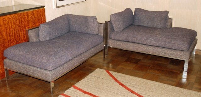Pair of Mid Century Modern Settees: Each over upholstered, with chrome frame. Height 25 inches, width 56 inches, depth 33 inches.