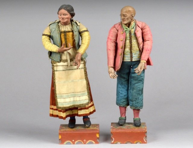 Pair of Neapolitan Creche Figures: Late 18th / early 19th century. Fabric, straw, terra cotta, and wood figures of a man and woman. Each on a painted wood base. Height approximately 14 inches.