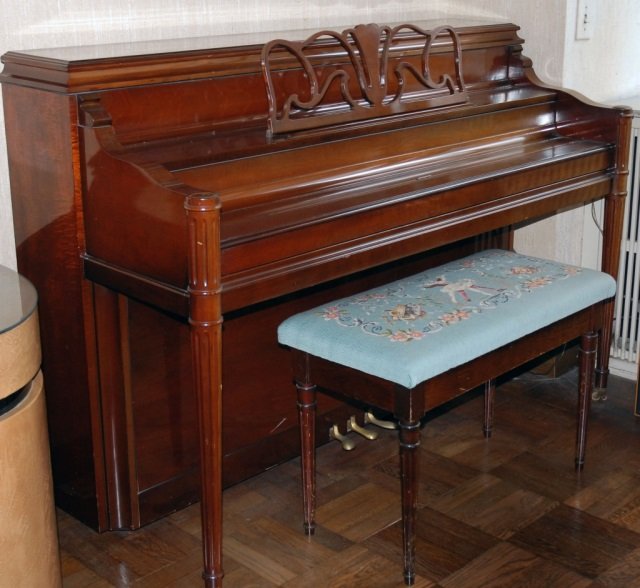 Sohmer & Co. Vertical Console Piano: Ivory keys, raised on front turned tapered fluted legs; Together with bench. Piano height 42 inches, width 58 inches, depth 25 inches.