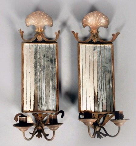 Set of Four Tole Mirrored Back Two Arm Sconces: Painted and patinated tole concave mirrored back sconces. Height 19 inches, width 7 inches.