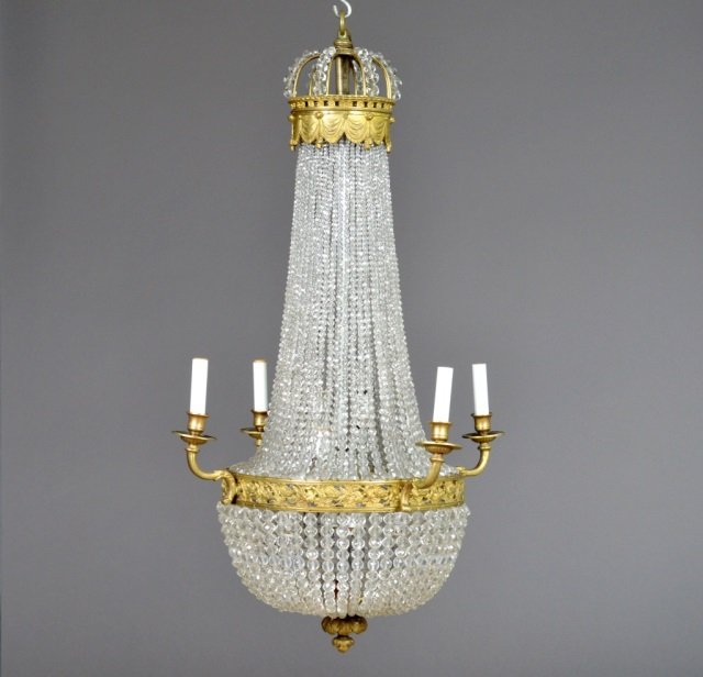 Gilded Bronze Crystal Bead Salon Fixture: Four arms with eight interior lights. Crow motif. Height 38 inches, diameter 24 inches.