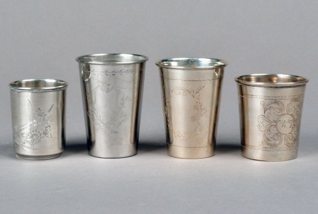 Group of Four Silver Kiddish Cups: Comprising two 19th century Russian cups, one Austro-Hungarian cup, and one continental cup. Tallest height 3 1/4 inches. Approximately 8.95 oz.