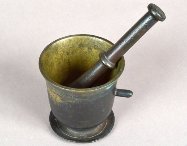 Early Continental Bronze Mortar and Pestle: 17thcentury. Height 6 inches, diameter 5 3/4 inches.