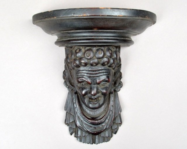 Black Forest Carved Wood Wall Bracket: Carved face motif. Height 9 inches, width 8 1/4 inches, depth 4 inches.