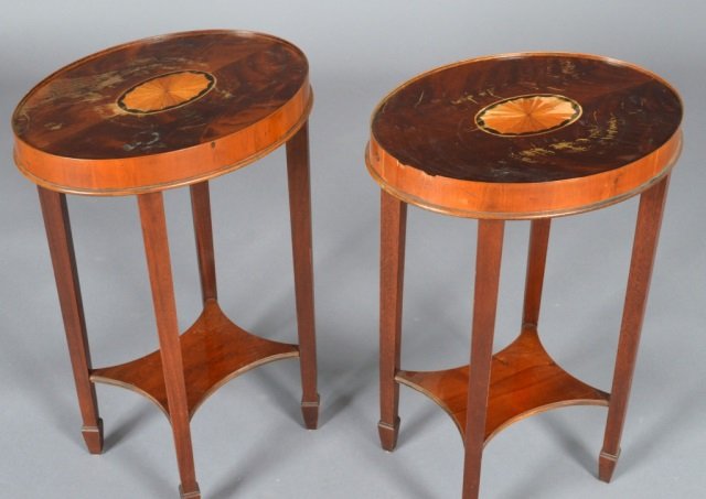 Pair of Hepplewhite Style Oval Occasional Tables: Each raised on four tapering rectangular legs. Height 25 inches, width 17 inches, depth 13 1/2 inches.