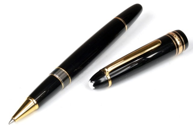 Montblanc Meisterstuck Pix Ballpoint Pen: Black resin barrel with three gold plated rings embossed with Montblanc brand name. Individual serial number.