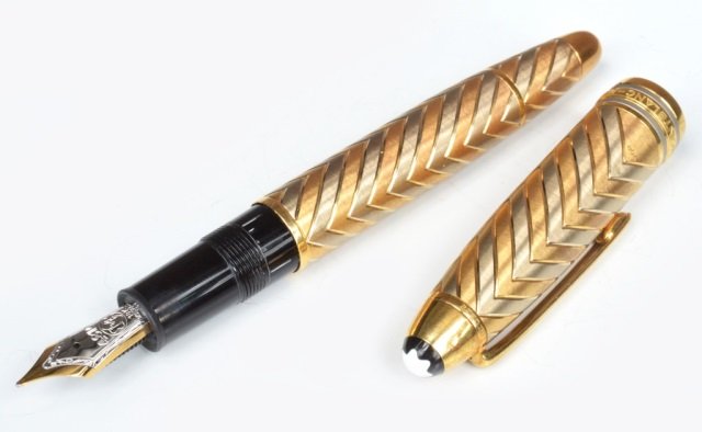 Montblanc Meisterstuck Solitaire Fountain Pen: Meisterstuck No. 146, 18kt two toned gold. Marked "4810, M, 18K, Montblanc, 750". Includes fitted case and instructional booklet.