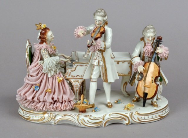Capodimonte Porcelain Figural Group: Parcel gilt decoration, depicting musicians. Height 9 inches, width 11 inches.