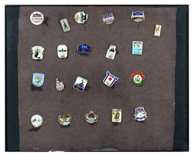 Olympic Medal Pins: 21 pins including pins from 1920 Antwerp, 1932 Los Angeles, 1936 Berlin, 1952 Oslo, 1956 Melbourne, etc.