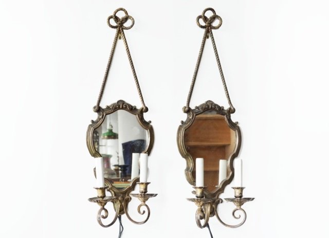 Pair of Two Light Mirrored Back Wall Sconces: Early 20th century. Attributed to J.E. Caldwell. 31 x 10 inches.