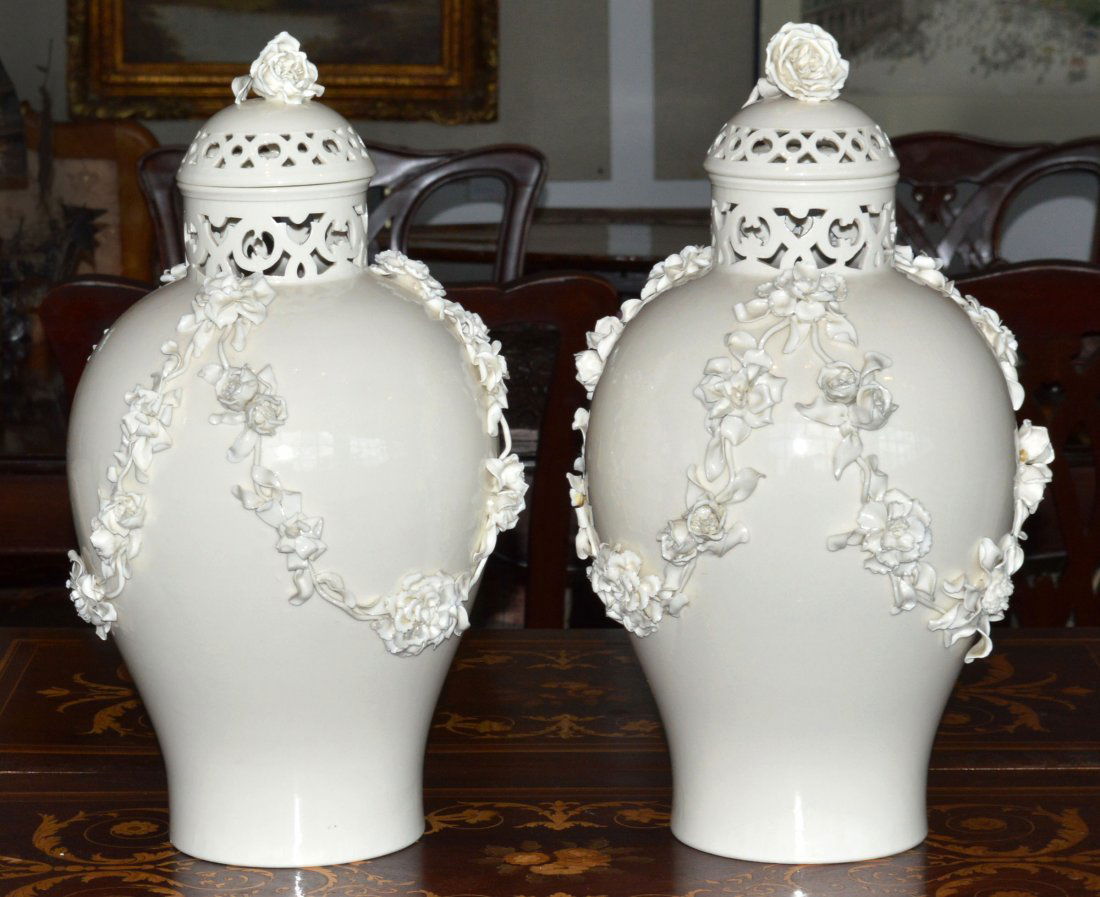 Pair of Nymphenburg Blanc de Chine Pierced Vases: With raised floral garland motif. Height 14 inches.