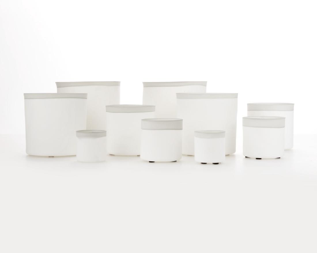 Pieter Stockmans (1940-* Flemish): Each with maker's marks to underside, two graduated sets of thin-walled cylindrical white porcelain bowls, each with a light gray lip, 10 pieces, each of the largest: 5.125'' H x 5.25'' W x 5'' D; eac