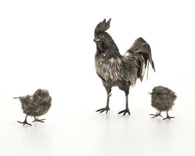 A Buccellati sterling silver rooster & two chicks: Late 20th century, the rooster with maker's marks of Mario Buccellati, further marked: 925, the chicks apparently unmarked, each elaborately modeled with fine silver wire and thin silver feathers, 3