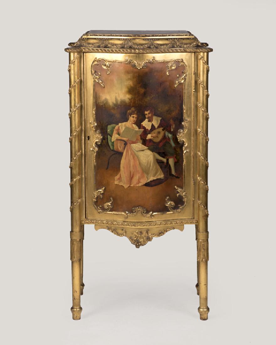 A Louis XVI-style Vernis Martin music cabinet: Late 19th/early 20th century The beveled top carved with a floral garland border centering painted chrysanthemums, atop a bow-front locking door painted with a scene of a courting couple enclosing six