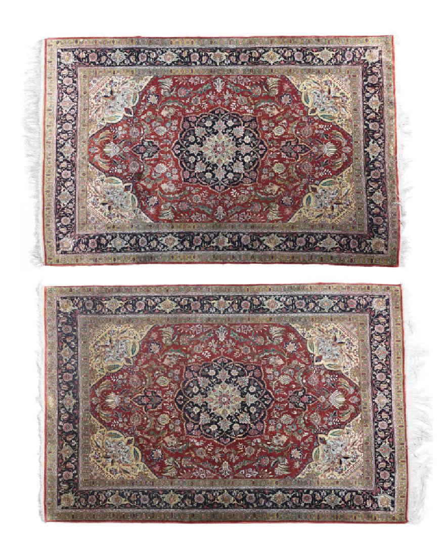 A pair of Iranian Isfahan silk carpets (1 of 5)