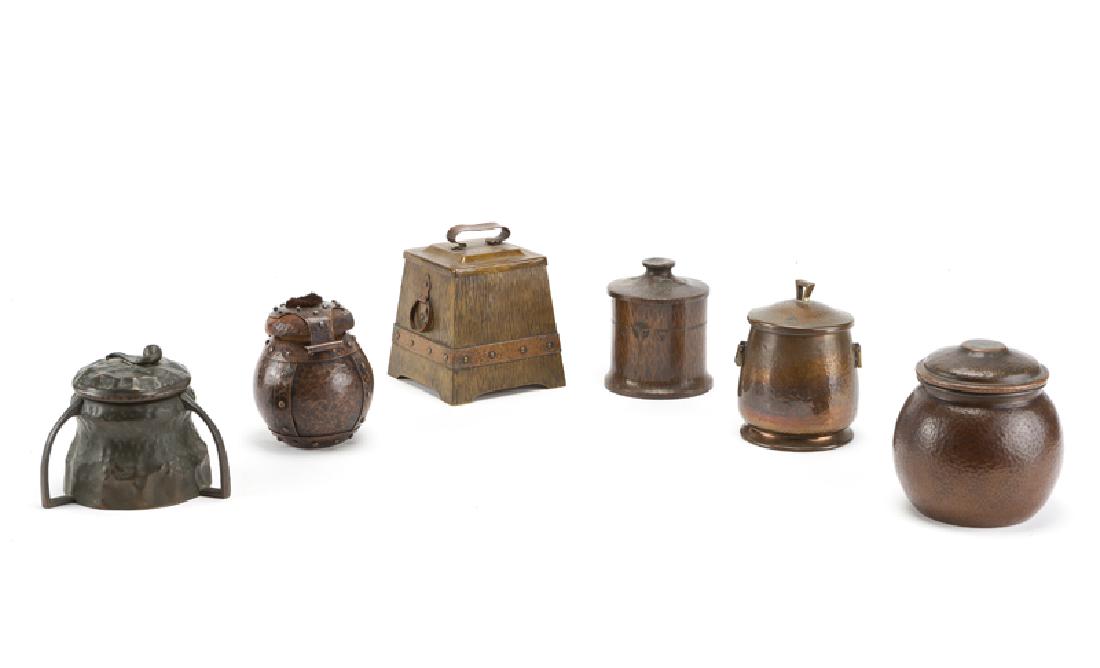 Six Arts & Crafts hammered copper humidors: First half 20th century The first: marked: Jos. Heinrichs / Paris + New York / Pure Copper / Sterling Silver, squat circular form (6.125'' H x 5.5'' Dia.); the second: marked: Apollo Studios / New Yor