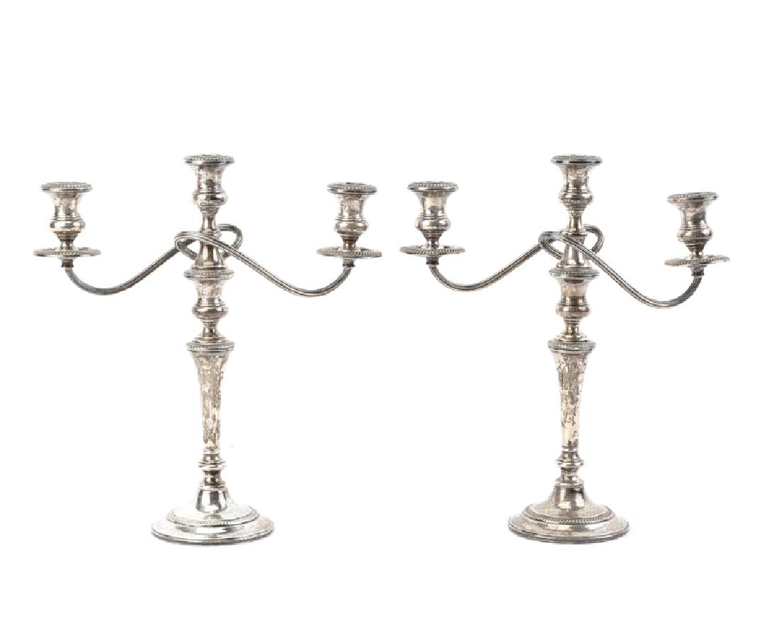A pair of convertible sterling silver candelabra, (1 of 2)