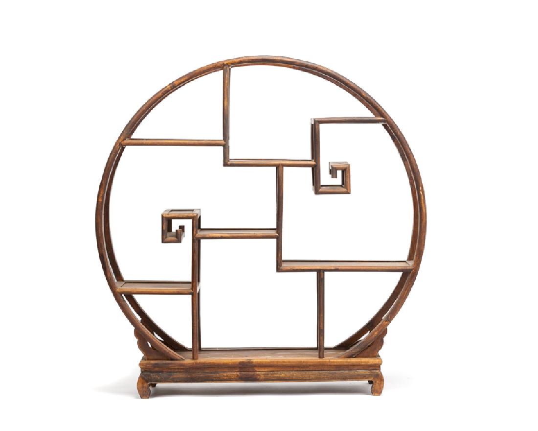 A Chinese circular ''full moon'' style etagere (1 of 2)