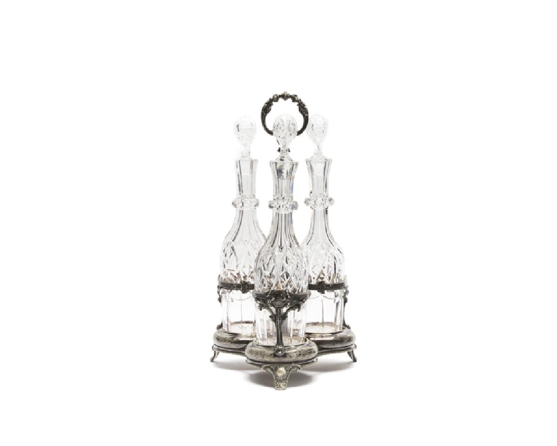 A silver-plated cruet set with cut-crystal decanters (1 of 1)