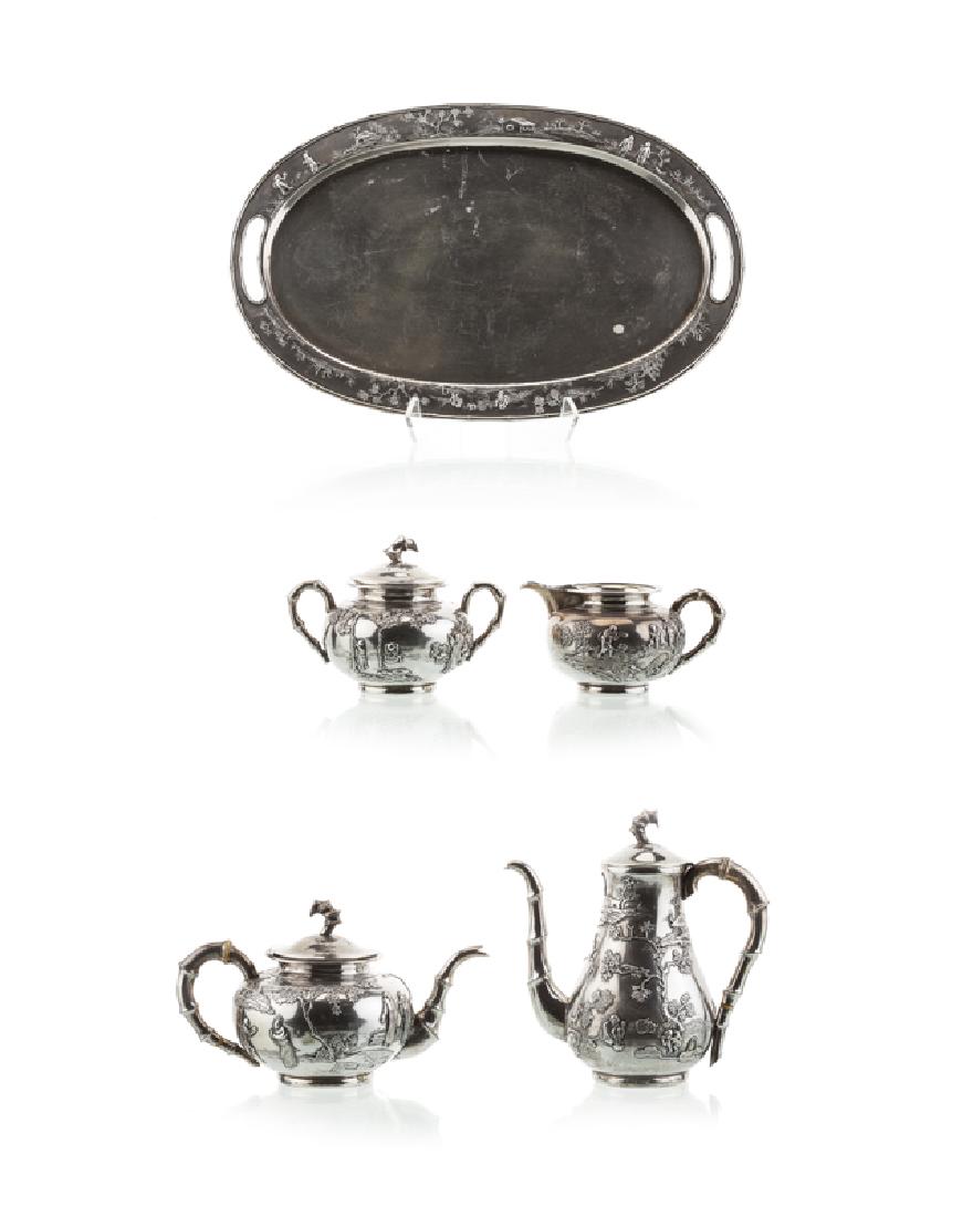 A Chinese silver coffee and tea service: First quarter 20th century Some pieces marked for distributor Zee Wo and possible maker Yi Shen Raised decoration depicting scenes of country life with bamboo-form handles with bone insulators, compri
