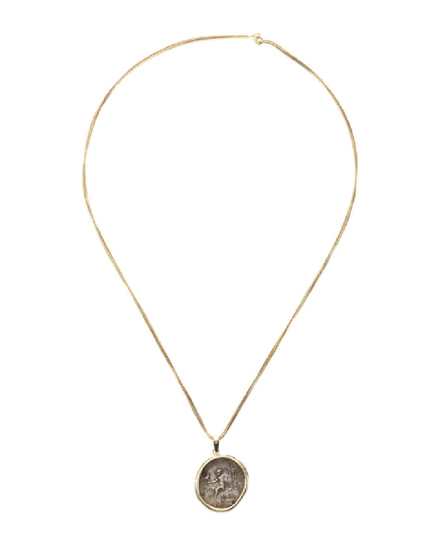 A gold and metal coin necklace (1 of 3)