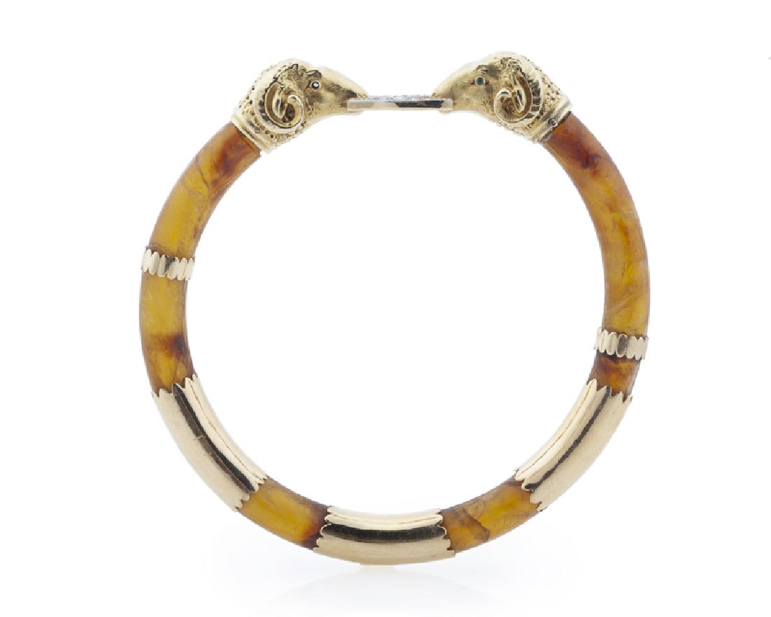 An amber and diamond ram's head bangle (1 of 2)
