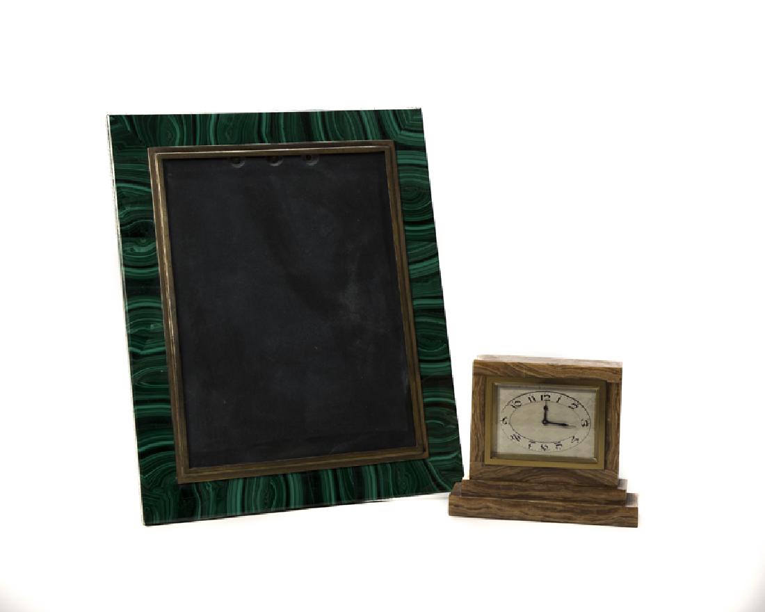 A group of decorative objects: First half 20th century Comprising an Art Deco brown marble clock (4.875" H x 5.75" W x 1.75" D) and malachite veneer and brass picture frame with stone backing (12.625" H x 10.25" W x .75" D), 2 piec