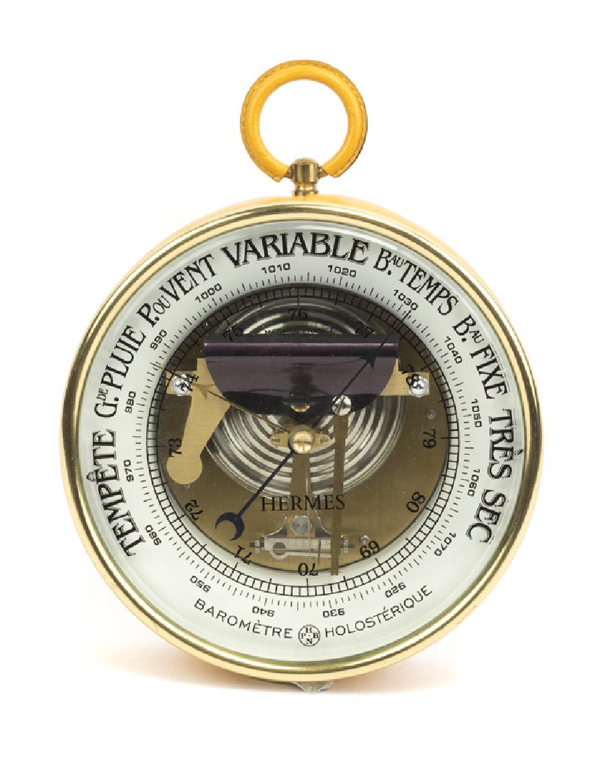 A yellow leather-wrapped barometer (1 of 3)