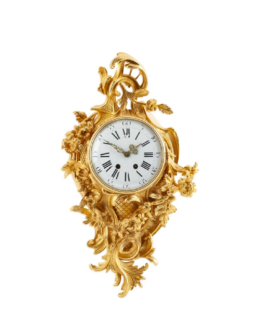 A gilt-bronze wall cartel clock (1 of 2)