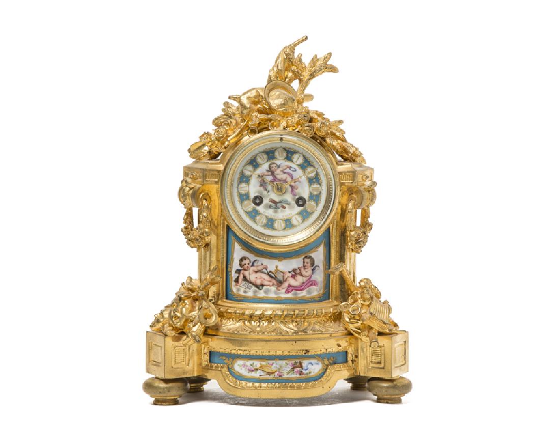 A French gilt-bronze and porcelain mantel clock, (1 of 3)