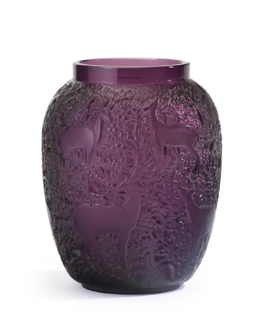 A Lalique ''Biches'' violet art glass vase: Second half 20th century Etched signature to underside: Lalique France With a short cylindrical neck over a pulled ovoid body decorated with deer in foliage 6.875" H x 5.5" Dia.