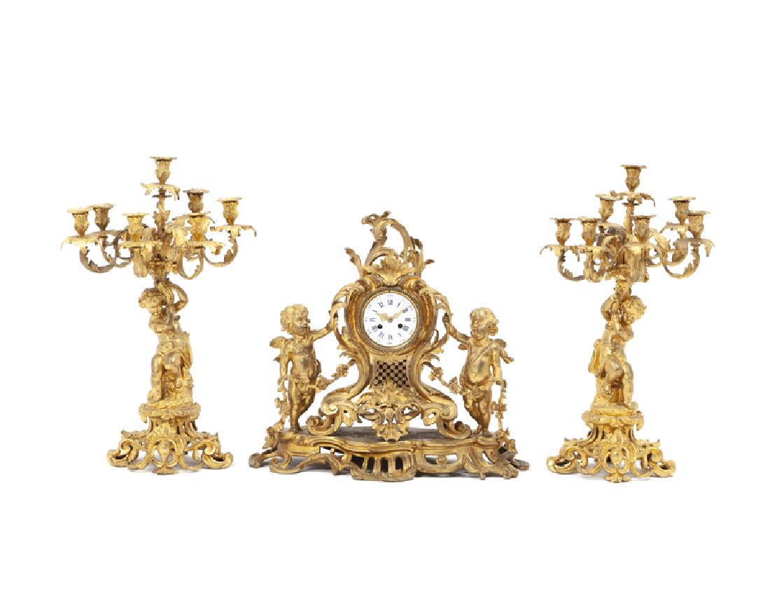 A Louis XV-style gilt-bronze mantel clock and garniture (1 of 4)