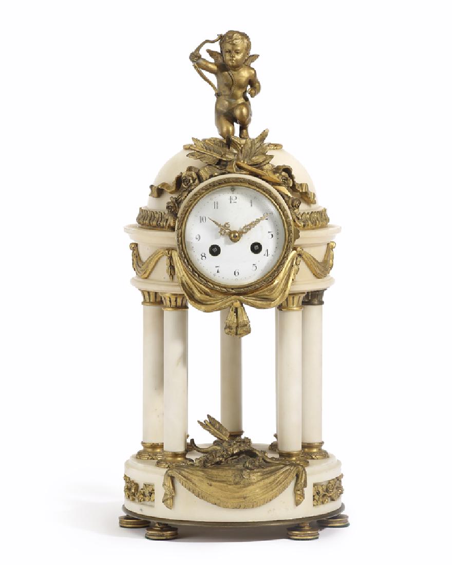 A French white alabaster and gilt bronze mounted: Mid-19th century Signed to the putti: J. Garnier; further marked with Vincent et Cie. Medaille d'Argent pastille Surmounted by a gilt putto with bow atop a white alabaster domed gazebo-style case ador