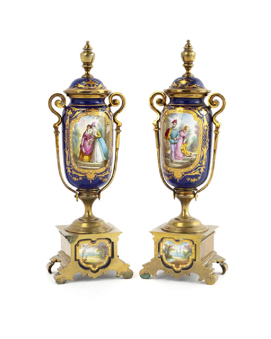 A pair of brass-mounted porcelain lidded urns (1 of 2)