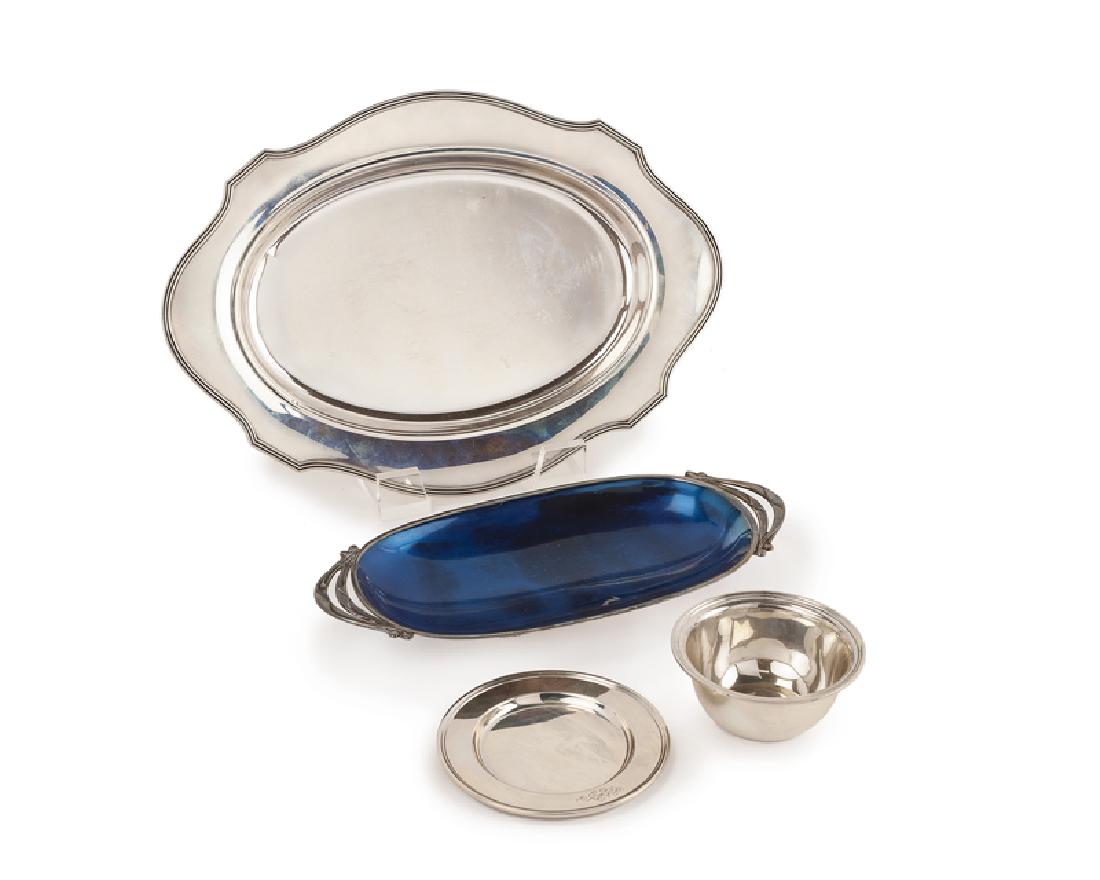 Four silver table accessories: First half 20th century All but the enamel tray stamped: Sterling Comprising a sterling silver oval tray with scalloped border, a small sterling silver bowl with separate fitted underplate, and an ova
