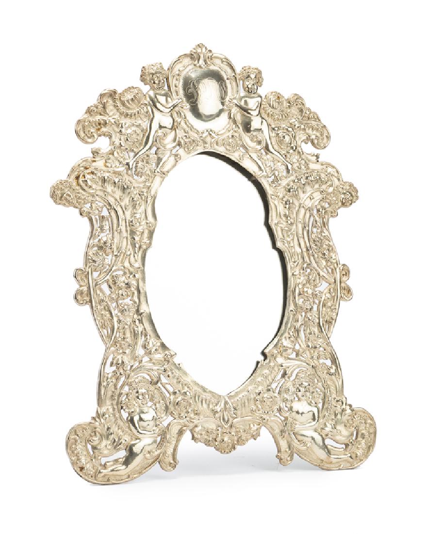 A silver-plated vanity mirror (1 of 2)