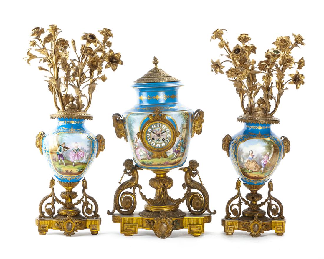 A French gilt-bronze and porcelain clock and garniture (1 of 7)